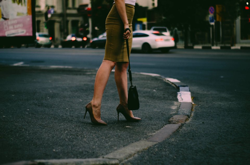 Womans Holding Black Sling Bag