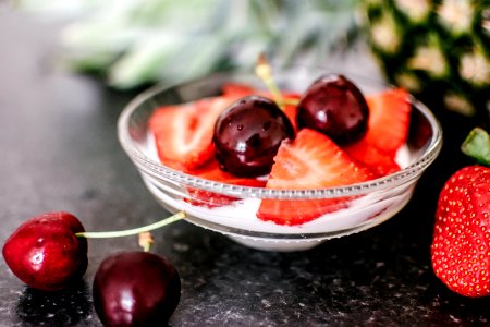 Cherries And Sliced Strawberries On Clear Bowl