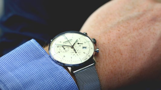 Person Wearing Silver-colored Analog Watch photo