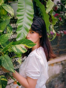 Photo Of Woman Near Plants photo