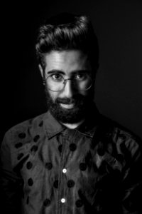 Grayscale Photography Of Man Wearing Eyeglasses photo