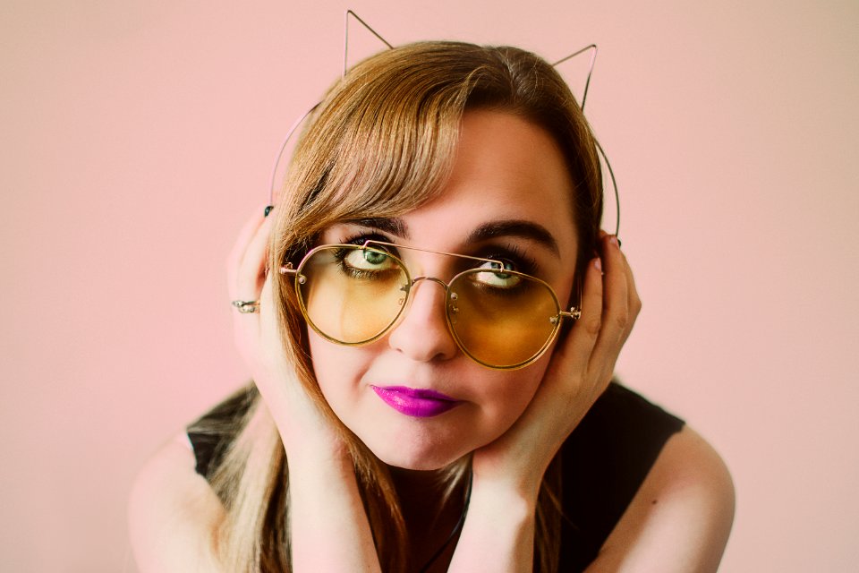 Woman Wearing Sunglasses And Alice Band