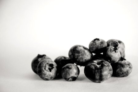 Grayscale Photography Of Blueberries photo