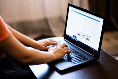 Person Typing On Laptop photo