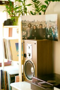 Photo Of Group Of Men On Top Of Brown Speaker photo