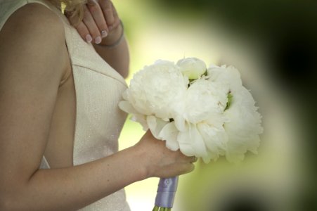 Woman Holding White Flower Bouquet photo