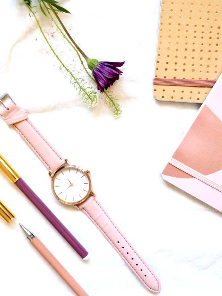 Flat Lay Photography Of Watch Near Pens And Notebook