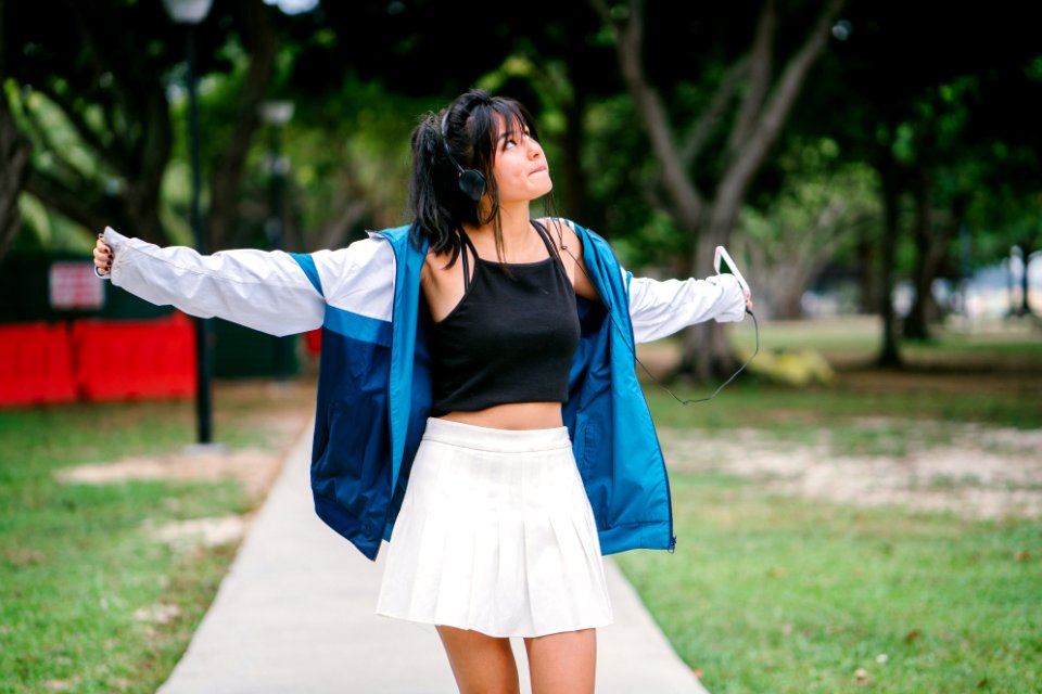 Woman Wearing Jacket Crop Top And Mini Skirt