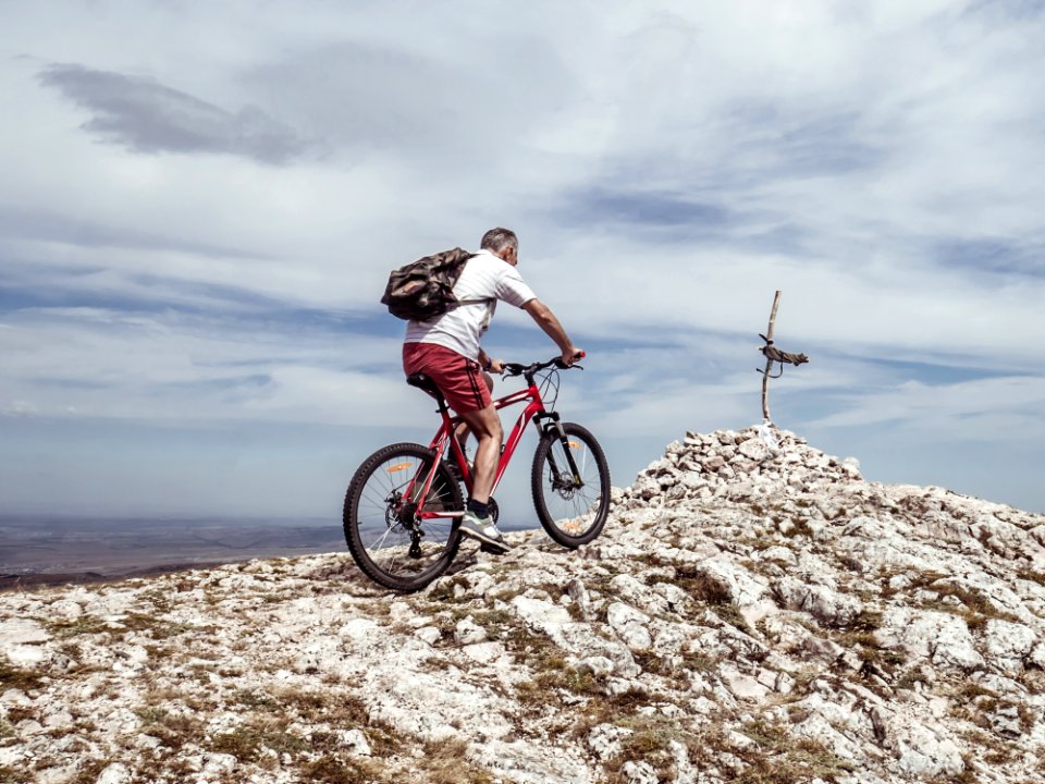 Man Riding Bicycle On Off-road photo