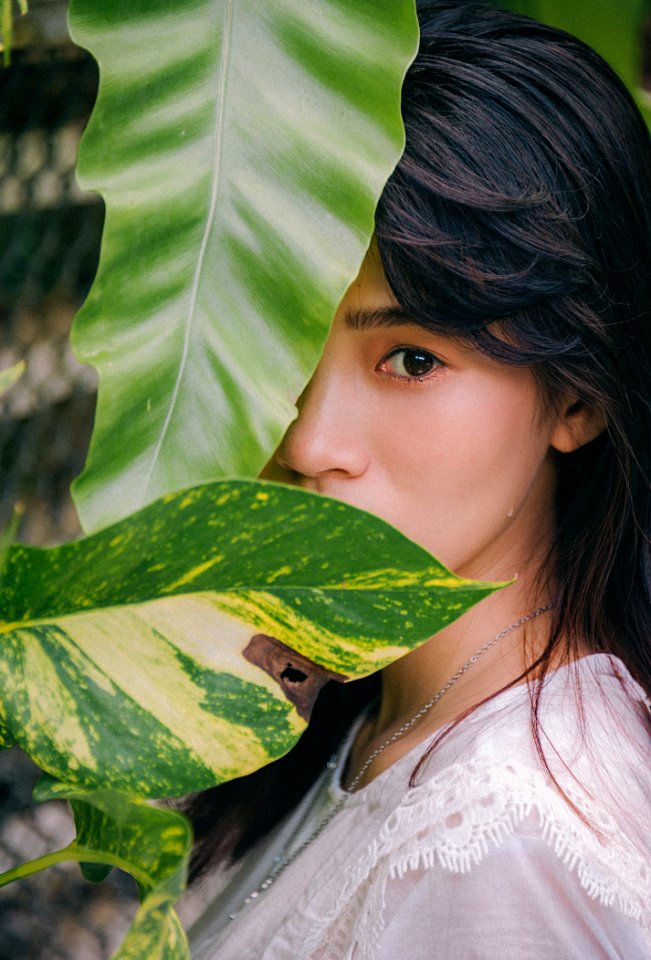 Closeup Photo Of Woman Wearing White Crew-neck Top