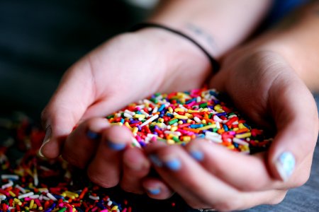 Person Holding Full Of Sprinkles
