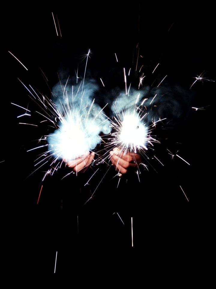 Photo Of Person Holding Sparklers