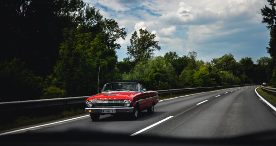 Photography Of Red Car On Road photo