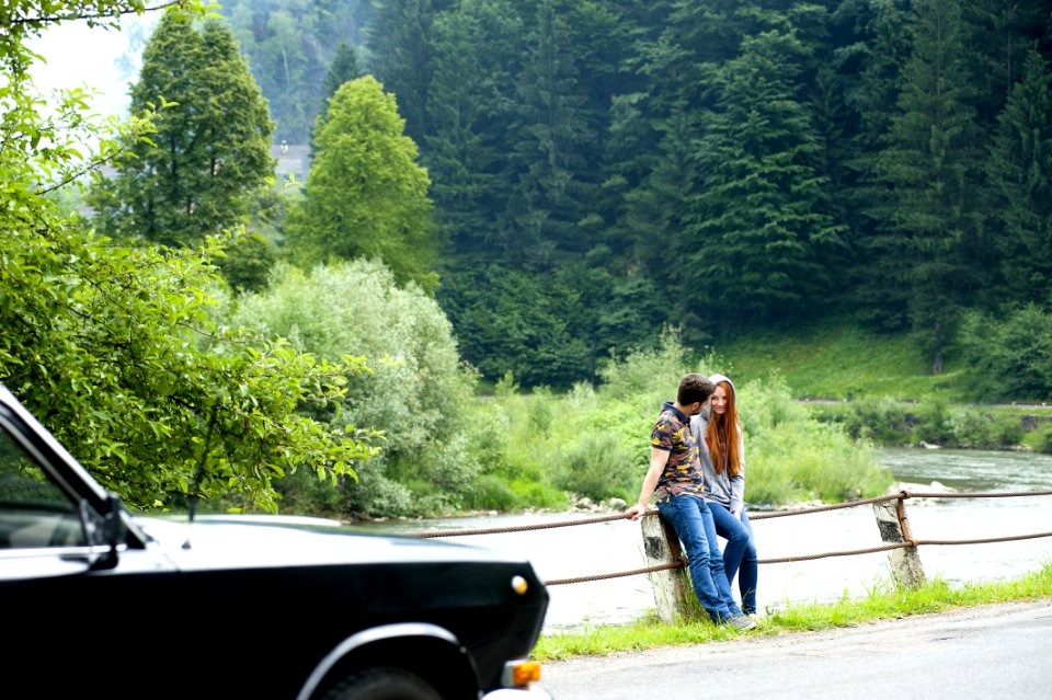 Man And Woman Sitting On Road Gutter