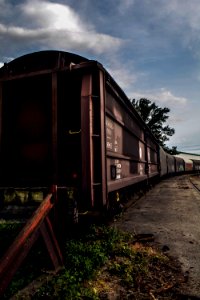 Brown And Black Train Under White Clouds