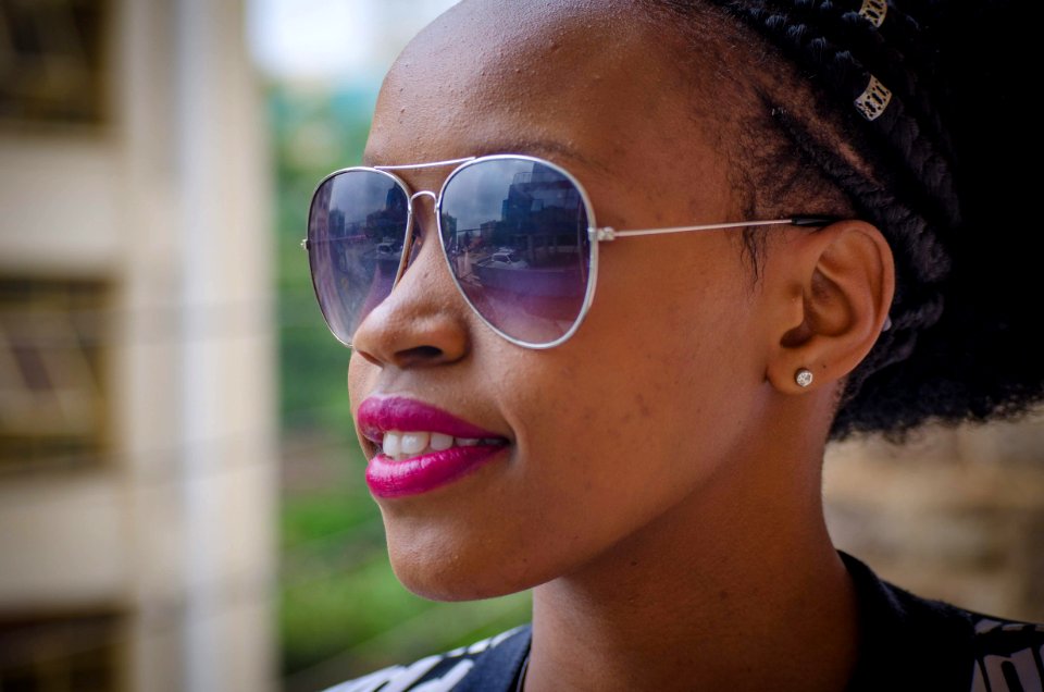 Woman Wearing Gray Framed Sunglasses And Pink Lipstick
