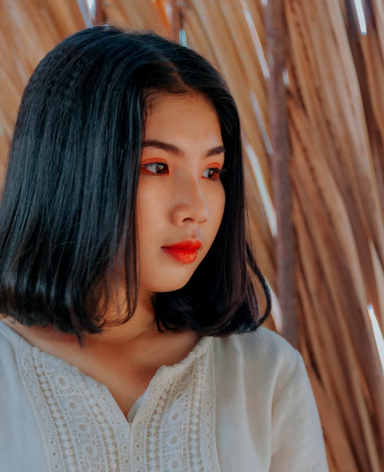 Woman Wearing White Top With Red Lipstick photo