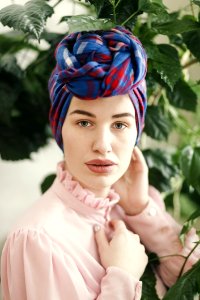 Woman In Pink Long-sleeved Top And Blue And Red Headdress photo