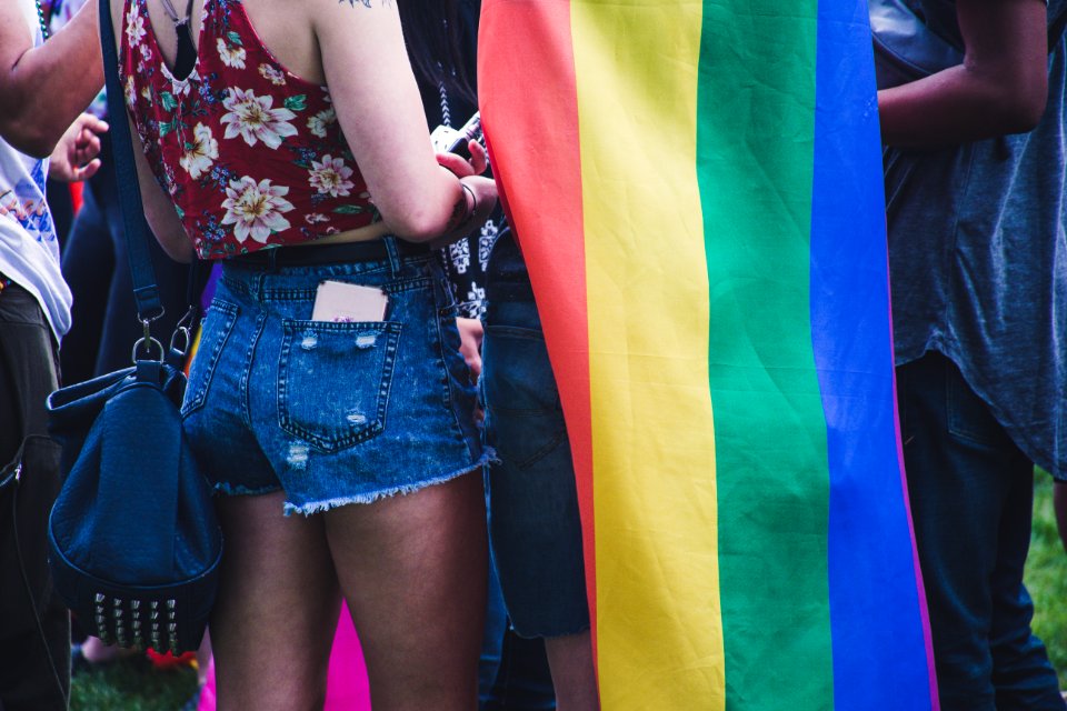 Closeup Photo Of Person Wearing Blue Denim Short Shorts Near The Flag