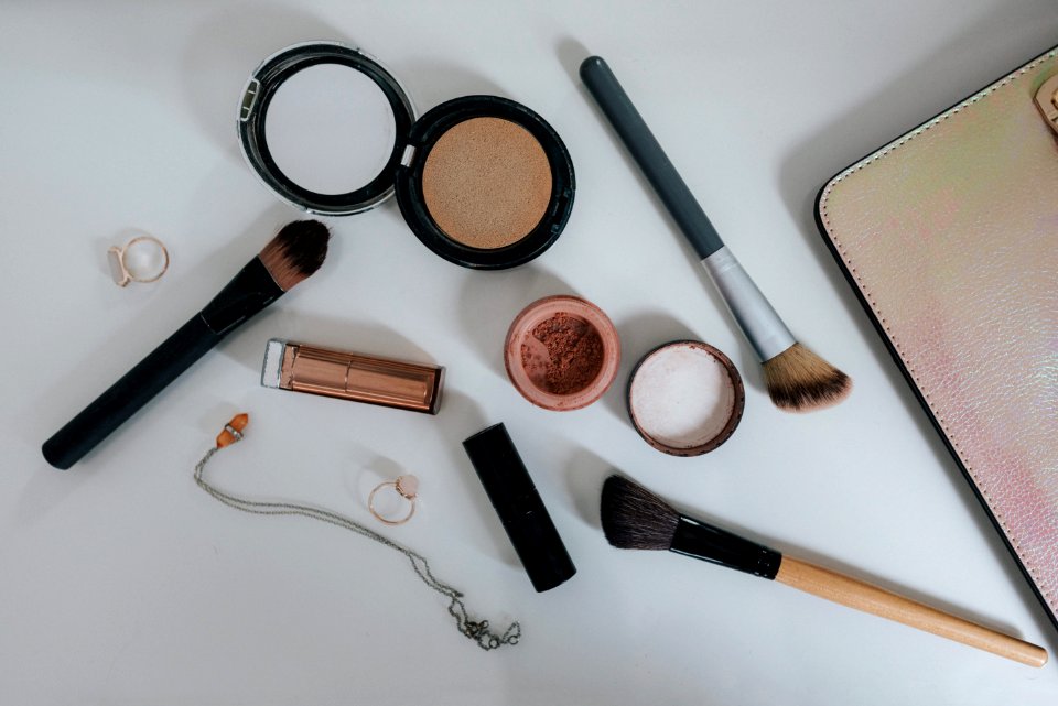 Flat Lay Photography Of Makeup Brushes And Compacts