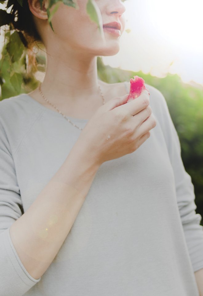 Woman Holding Sliced Fruit photo