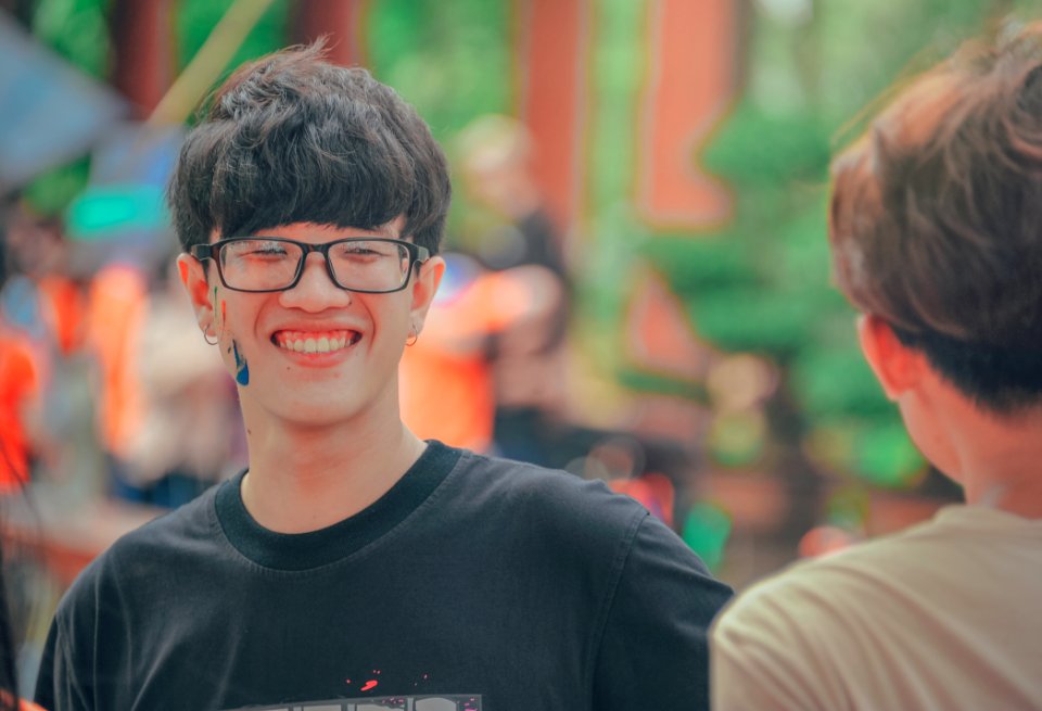 Smiling Man In Black Shirt Wearing Eyeglasses photo