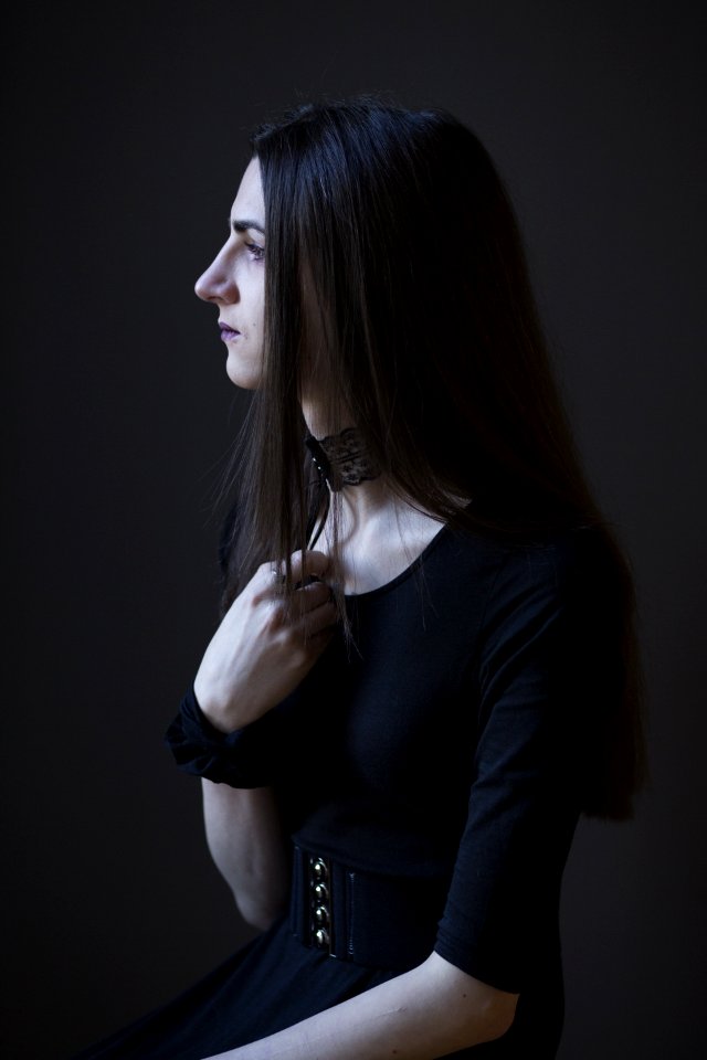 Black Haired Woman In Black Top