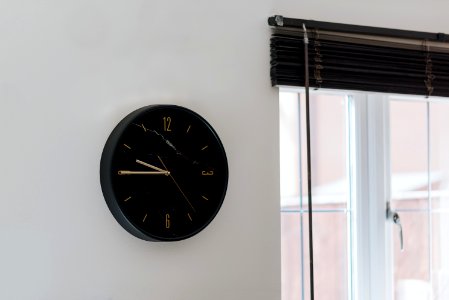 Round Black Steel Analog Wall Clock photo