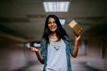 Woman Holding Brown Cardboard Box photo
