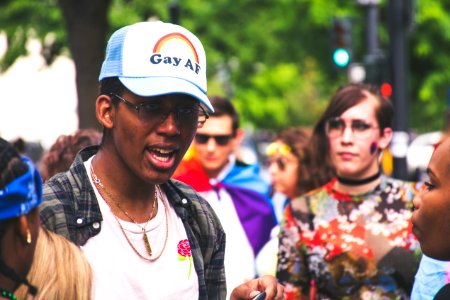 Man With White Crew-neck Shirt Beside Woman With Multicolored Shirt At Daytime photo