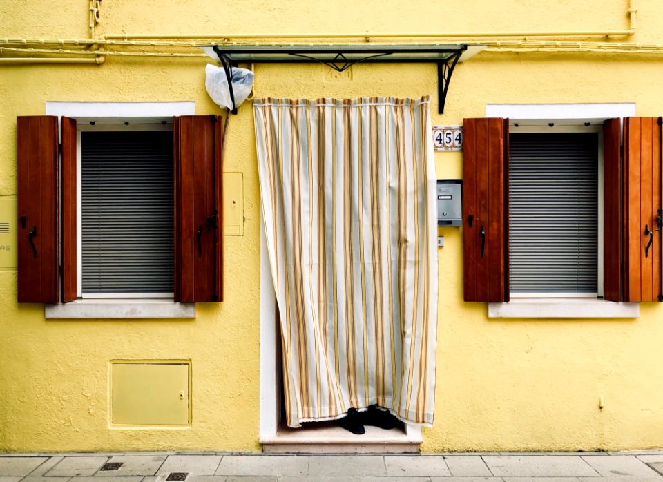 White And Brown Curtain On Yellow Wall