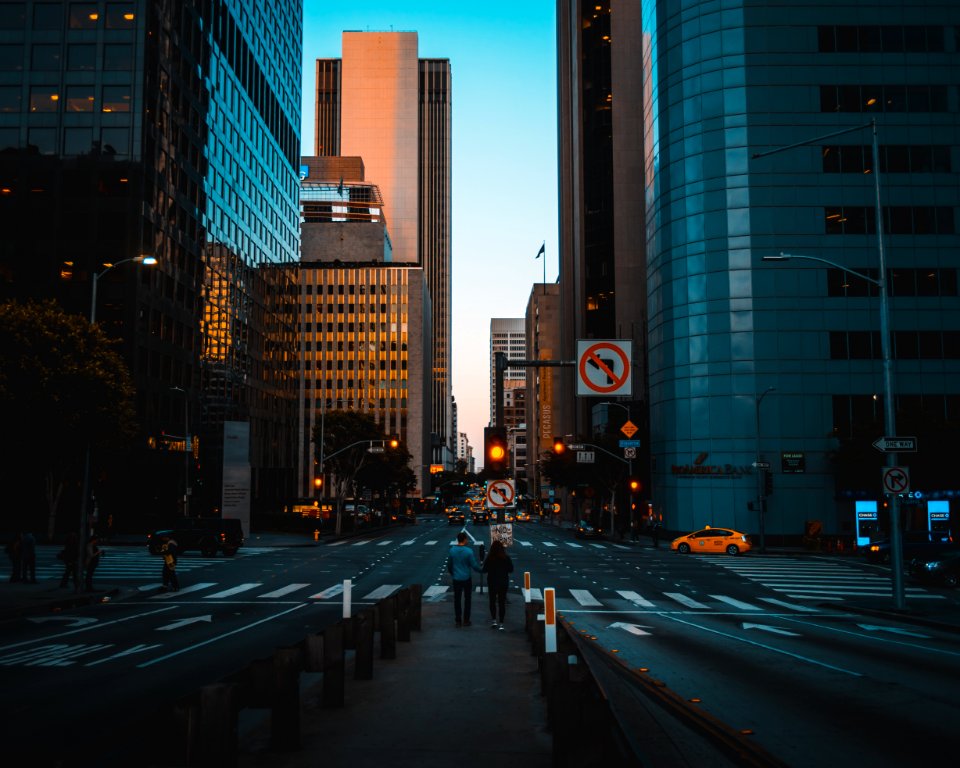 Two Persons Standing On The Street