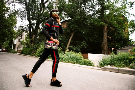 Woman Wearing Black-red-and-green Tracksuit photo