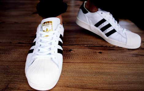 Pair Of White-and-black Adidas Superstars photo