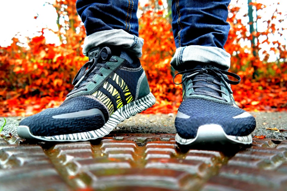Shallow Focus Photography Of Pair Of Black Black-and-white Adidas Running Shoes
