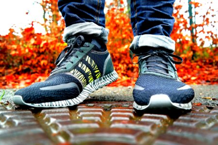 Shallow Focus Photography Of Pair Of Black Black-and-white Adidas Running Shoes photo