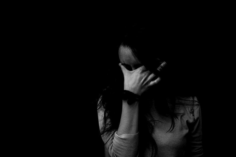 Grayscale Photography Of Woman Touching Her Eyes