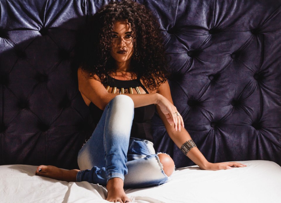 Woman Leaning On Tufted Wall