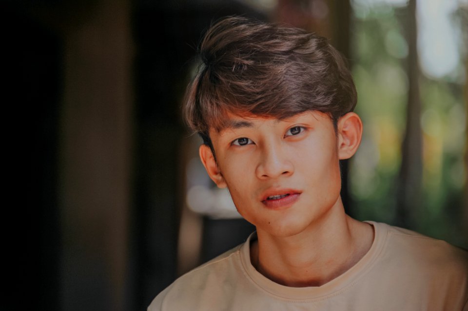 Selective-focus Photography Of Man Wearing Beige Crew-neck Shirt
