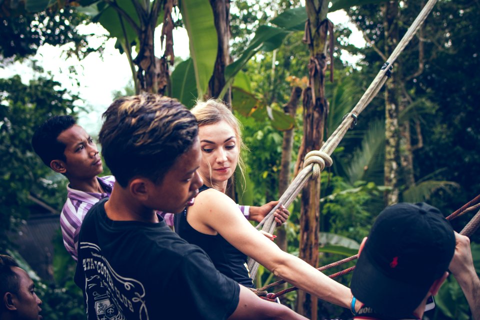 Blonde Haired Woman Wearing Black Tank Top Holding Rope