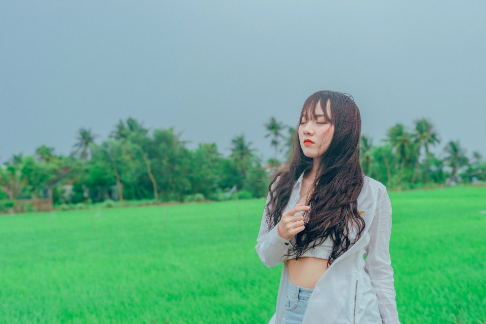 Woman Wearing Gray Cardigan On Green Grass