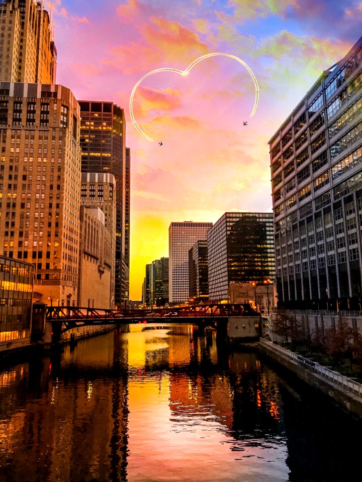 Two Black Aircrafts Above Buildings Golden Hour