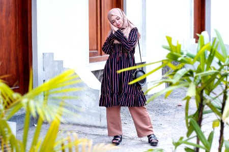 Woman Wearing Abaya Dress And Standing On Ground