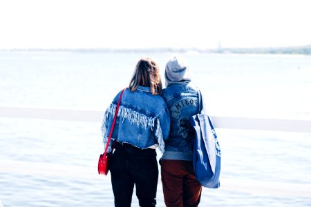 Two People Looking At The Beach