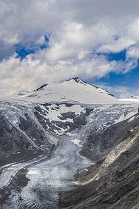 Glacier mountains clouds photo