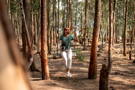 Young Woman On The Swing In The Forest Bali Island