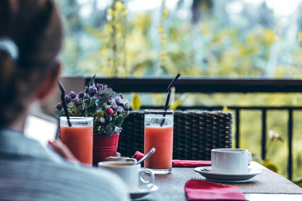 Young Woman Drinking A Cup Of Coffee In The Morning With The Jungle View During Luxury Vacation In Bali Island