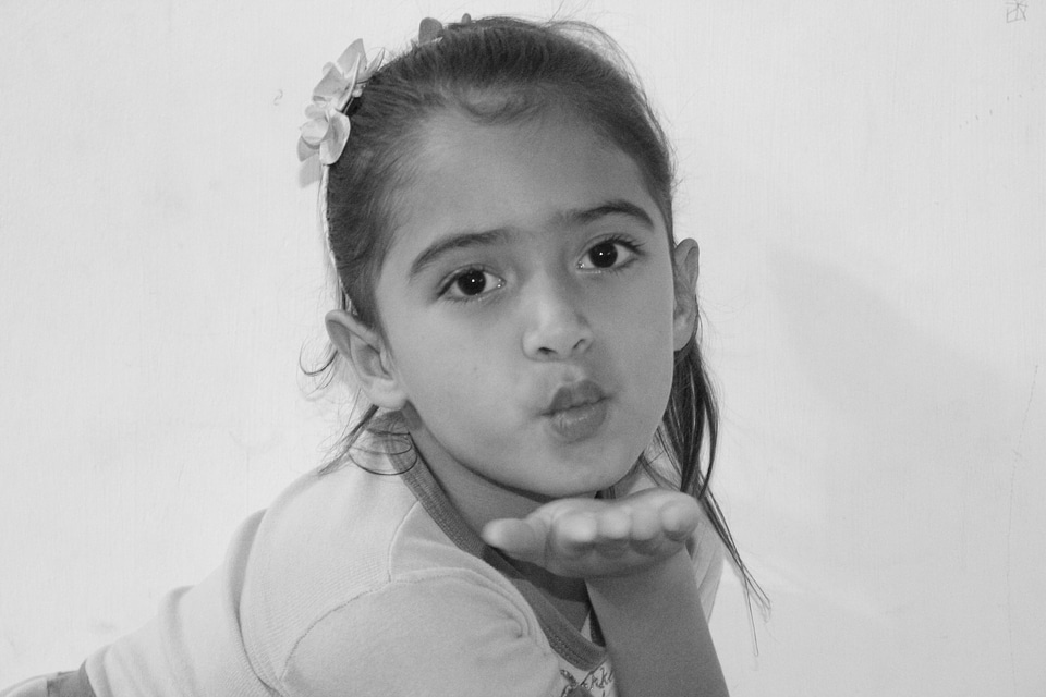Peck little girl sending kiss