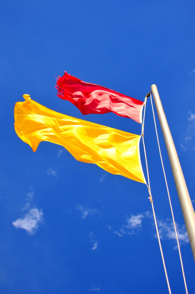 Sky, Flag, Yellow, Daytime