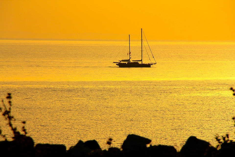 Sailing boat sunset sea